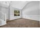 Living room featuring a large window providing natural light, and wainscoting details at 3534 Oakshire Se Way, Atlanta, GA 30354