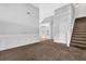 Spacious living room with neutral carpet and staircase at 3534 Oakshire Se Way, Atlanta, GA 30354