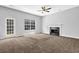 Spacious living room with fireplace, large window, and door to the outside at 3534 Oakshire Se Way, Atlanta, GA 30354