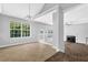 Open-concept living room with tile floors, fireplace, and view of staircase at 3534 Oakshire Se Way, Atlanta, GA 30354