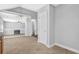 View of the kitchen and attached living room, divided by a staircase at 3534 Oakshire Se Way, Atlanta, GA 30354