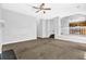 Open living room with neutral carpet and staircase visible at 3534 Oakshire Se Way, Atlanta, GA 30354