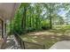Expansive backyard with lush lawn and mature trees and shrubbery at 3661 Boring Rd, Decatur, GA 30034