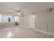 Spacious basement with tile flooring, painted walls, and an open area with a staircase at 3661 Boring Rd, Decatur, GA 30034