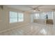 Finished basement area showcasing tile flooring, staircase, and a bright window for natural light at 3661 Boring Rd, Decatur, GA 30034