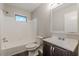 Well-lit bathroom with a tub/shower combo, updated vanity, and classic tilework creates a functional space at 3661 Boring Rd, Decatur, GA 30034