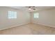 Bedroom featuring neutral walls, carpet, ceiling fan, and natural light through a large window at 3661 Boring Rd, Decatur, GA 30034