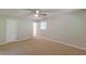 Bedroom featuring neutral walls, carpet flooring, a ceiling fan, and access to an ensuite bathroom at 3661 Boring Rd, Decatur, GA 30034