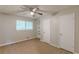 Bedroom with neutral walls, carpet floors, ceiling fan, and two closets offers a comfortable space at 3661 Boring Rd, Decatur, GA 30034