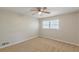 A large bedroom features neutral walls, carpeted floor, a ceiling fan, and bright natural light from a window at 3661 Boring Rd, Decatur, GA 30034