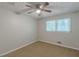 Bedroom featuring neutral walls, carpet flooring, a ceiling fan, and a window for natural light at 3661 Boring Rd, Decatur, GA 30034