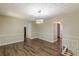 Dining room area features new floors and modern light fixture at 3661 Boring Rd, Decatur, GA 30034