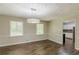 Dining room features new hardwood floors and modern lighting at 3661 Boring Rd, Decatur, GA 30034