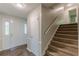 Welcoming entryway featuring carpeted stairs, a solid front door, and decorative side windows at 3661 Boring Rd, Decatur, GA 30034