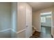 Light-filled hallway with a coat closet and hardwood floors at 3661 Boring Rd, Decatur, GA 30034