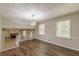 Spacious living room with hardwood floors, modern light fixture, and lots of natural light at 3661 Boring Rd, Decatur, GA 30034