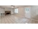 Living area with tile floors, ceiling fan, brick fireplace, built-in shelving, and access to the backyard at 3661 Boring Rd, Decatur, GA 30034