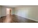 Open living room features wood-look flooring and neutral paint at 3661 Boring Rd, Decatur, GA 30034