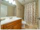 Bathroom featuring a well-lit mirror and a shower with a patterned shower curtain at 3677 Blackshear Ct, Duluth, GA 30096