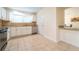 Well-lit kitchen featuring white cabinets, granite countertops, stainless steel appliances, and tile flooring at 3677 Blackshear Ct, Duluth, GA 30096