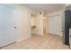 Kitchen features a stainless steel refrigerator, tan tile flooring, and a breakfast bar open to the dining area at 3677 Blackshear Ct, Duluth, GA 30096