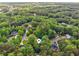 Aerial view of a home nestled among lush greenery in a serene, wooded neighborhood at 1275 Fontainebleau Ct, Lawrenceville, GA 30043