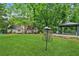 Expansive backyard lawn with gazebo, patio, and disc golf; ideal for outdoor activities and entertaining at 1275 Fontainebleau Ct, Lawrenceville, GA 30043