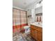 The bathroom is equipped with a shower, vanity, and other necessary fixtures and neutral colors at 1275 Fontainebleau Ct, Lawrenceville, GA 30043