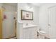Bathroom featuring a shower with gold trim and white fixtures at 1275 Fontainebleau Ct, Lawrenceville, GA 30043