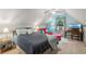 Bedroom includes sloped ceilings, a comfortable bed, and a desk, perfect for relaxing or working at 1275 Fontainebleau Ct, Lawrenceville, GA 30043