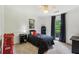 The simple bedroom features a comfortable bed, sleek furniture, and a window letting in natural light at 1275 Fontainebleau Ct, Lawrenceville, GA 30043