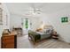 Sun-filled bedroom showcases a cozy sleeping space with neutral walls, and natural sunlight at 1275 Fontainebleau Ct, Lawrenceville, GA 30043
