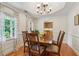 Inviting dining room with hardwood floors, natural light, and classic chandelier at 1275 Fontainebleau Ct, Lawrenceville, GA 30043