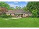 Charming brick home features a manicured lawn, mature trees, and a welcoming entrance for excellent curb appeal at 1275 Fontainebleau Ct, Lawrenceville, GA 30043