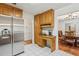 Spacious kitchen with stainless steel refrigerator and view into the dining area at 1275 Fontainebleau Ct, Lawrenceville, GA 30043