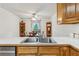 Functional kitchen with double sinks, wood cabinets and an eat-in breakfast area at 1275 Fontainebleau Ct, Lawrenceville, GA 30043