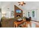Bright living room with brick fireplace, high ceilings, and hardwood floors at 1275 Fontainebleau Ct, Lawrenceville, GA 30043