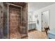 Main bathroom features a large glass shower with built-in bench, tile surround, and vanity at 1275 Fontainebleau Ct, Lawrenceville, GA 30043