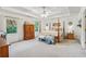 Spacious main bedroom boasts a trey ceiling, multiple windows, and a decorative four-poster bed at 1275 Fontainebleau Ct, Lawrenceville, GA 30043
