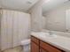 Well-lit bathroom with a single vanity and a shower/tub combination featuring a modern, patterned shower curtain at 2003 Burns View Ln # 2, Lawrenceville, GA 30044