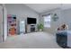 Spacious bedroom features a cozy hanging chair, natural light, and a large TV, offering a comfortable living space at 2003 Burns View Ln # 2, Lawrenceville, GA 30044
