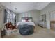 Cozy bedroom featuring a hanging chair, plush beanbag, and soft decor for a relaxing and inviting atmosphere at 2003 Burns View Ln # 2, Lawrenceville, GA 30044
