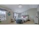 Serene bedroom with plush bedding, a hanging chair, and plenty of natural light, creates a relaxing retreat at 2003 Burns View Ln # 2, Lawrenceville, GA 30044