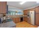 Bright kitchen boasts stainless steel appliances, granite countertops, and wood cabinets, offering a warm and inviting atmosphere at 2003 Burns View Ln # 2, Lawrenceville, GA 30044