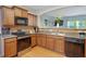 The updated kitchen offers modern stainless steel appliances, granite countertops, and a view to the living room at 2003 Burns View Ln # 2, Lawrenceville, GA 30044