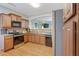 Well-equipped kitchen features modern stainless steel appliances, granite countertops, and ample cabinet space at 2003 Burns View Ln # 2, Lawrenceville, GA 30044