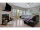 Inviting living room featuring a fireplace, ample seating, and abundant natural light at 2003 Burns View Ln # 2, Lawrenceville, GA 30044
