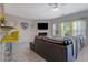 Bright living space featuring a kitchen bar, modern decor, and a view of the fireplace at 2003 Burns View Ln # 2, Lawrenceville, GA 30044