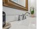 A close-up of a stylish bathroom sink with elegant fixtures, granite countertop, and decorative accents at 2870 Pharr Court South Nw # 2404, Atlanta, GA 30305