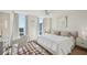 Bright bedroom with a large window, hardwood floors, a ceiling fan, and neutral decor at 2870 Pharr Court South Nw # 2404, Atlanta, GA 30305